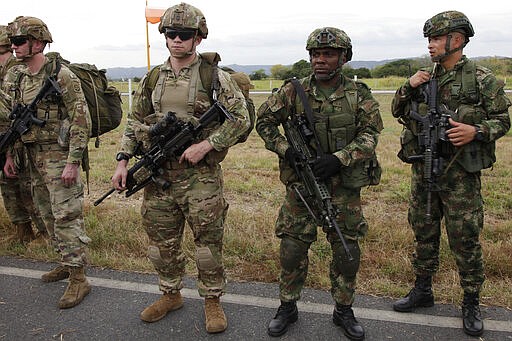 In this Jan. 24, 2020, photo, American and Colombian paratroops rehearse securing an airfield at Tolemaida Air Base in Colombia. The 82nd's Spanish-speaking paratroopers were used to translate between the forces. (AP Photo/Sarah Blake Morgan)