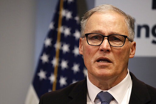 Washington Gov. Jay Inslee addresses a news conference about the coronavirus outbreak Monday, March 16, 2020, in Seattle. Inslee ordered all bars, restaurants, entertainment and recreation facilities to temporarily close to fight the spread of COVID-19, the disease that is caused by the new coronavirus, in the state with by far the most deaths in the U.S. from the disease. (AP Photo/Elaine Thompson, Pool)