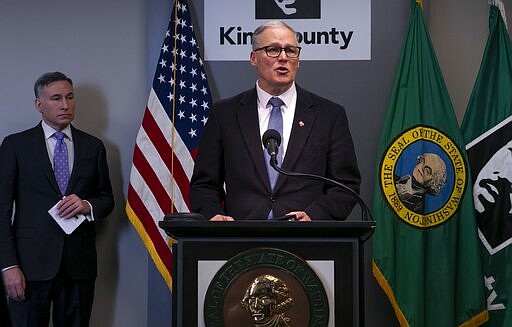 Washington Gov. Jay Inslee talks at a news conference about the coronavirus outbreak in downtown Seattle, Monday, March 16, 2020. (Erika Schultz/The Seattle Times via AP)