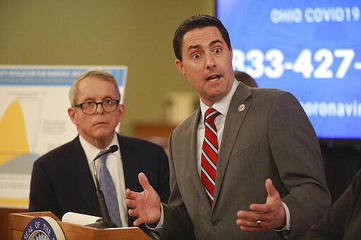 Moments after announcing the possible extension of Ohio voting until June 2, Ohio Secretary of State Frank LaRose answers a reporter's question at a coronavirus news conference Saturday, March 14, 2020 at the Ohio Statehouse. (Doral Chenoweth/The Columbus Dispatch via AP)