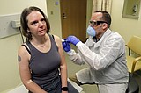 AP Exclusive: Coronavirus vaccine test opens with 1st doses