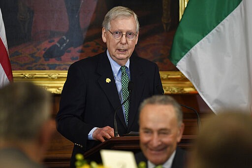 Senate Majority Leader Mitch McConnell of Ky., top, speaks during a lunch with Irish Prime Minister Leo Varadkar on Capitol Hill in Washington, Thursday, March 12, 2020. Senate Minority Leader Sen. Chuck Schumer of N.Y., also attends, bottom. (AP Photo/Susan Walsh)