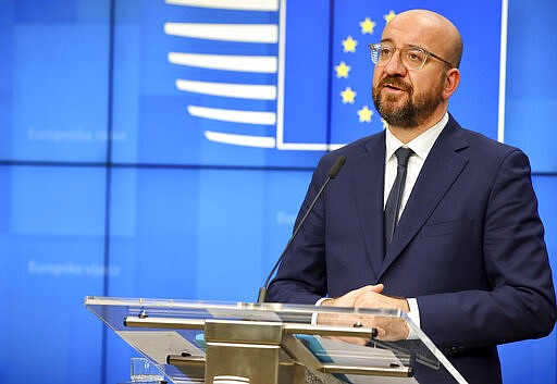 European Council President Charles Michel addresses the media after a video-conference with G7 leaders at the European Council building in Brussels, Monday, March 16, 2020. European Commission President Ursula von der Leyen wants the European Union to put in place a 30-day ban on people entering the bloc for non-essential travel reasons in an effort to curb the spread of coronavirus. For most people, the new coronavirus causes only mild or moderate symptoms, such as fever and cough. For some, especially older adults and people with existing health problems, it can cause more severe illness, including pneumonia. (AP Photo/Olivier Matthys)