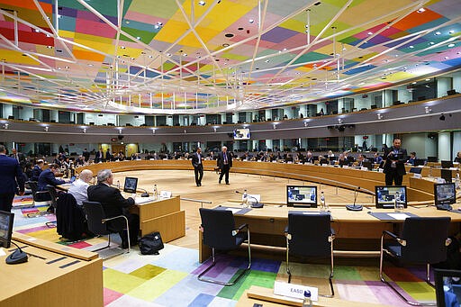 Photographers wait at the start of a meeting of EU interior ministers at the European Council building in Brussels, Friday, March 13, 2020. European Union interior ministers on Friday were trying to coordinate their response to the novel coronavirus as the number of cases spreads throughout the 27-nation bloc and countries take individual measures to slow the disease down. For most people, the new coronavirus causes only mild or moderate symptoms, such as fever and cough. For some, especially older adults and people with existing health problems, it can cause more severe illness, including pneumonia. (AP Photo/Thierry Monasse)