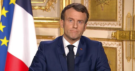 French President Emmanuel Macron gives a TV address to the nation announcing sweeping new measures to stem the spread of the new COVID-19 virus, saying people haven't complied with earlier public health measures and &#147;we are at war&#148;, in Paris Monday March 16, 2020. France is imposing nationwide restrictions on how far from their homes people can go, and for what purpose, as part of the country's strategy to stop the spread of the new coronavirus. For most people, the new coronavirus causes only mild or moderate symptoms, but for some it can cause more severe illness, especially in older adults and people with pre-existing health problems. (France Televisions via AP)