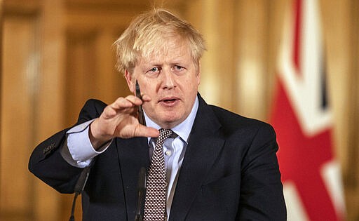 Prime Minister Boris Johnson gives a press conference about the ongoing situation with the COVID-19 coronavirus pandemic at 10 Downing Street in London, Monday March 16, 2020. According to the World&#160;Health Organization, the vast majority of people recover from the new COVID-19 coronavirus in about two to six weeks depending on the severity of the illness. (Richard Pohle/Pool via AP)