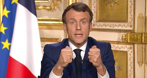 French President Emmanuel Macron gives a TV address to the nation announcing sweeping new measures to stem the spread of the new COVID-19 virus, saying people haven't complied with earlier public health measures and &#147;we are at war&#148;, in Paris Monday March 16, 2020. France is imposing nationwide restrictions on how far from their homes people can go, and for what purpose, as part of the country's strategy to stop the spread of the new coronavirus. For most people, the new coronavirus causes only mild or moderate symptoms, but for some it can cause more severe illness, especially in older adults and people with pre-existing health problems. (France Televisions via AP)