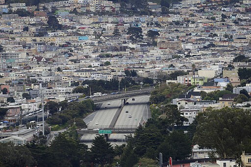 Light traffic moves along Interstate 280 in San Francisco, Monday, March 16, 2020. (AP Photo/Jeff Chiu)