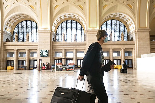 Washington Union Station, a major transportation hub in the nation's capital, is nearly empty during morning rush hour as many government and private sector workers stay home during the coronavirus outbreak, in Washington, Monday, March 16, 2020. (AP Photo/J. Scott Applewhite)