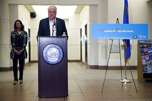 Nevada Gov. Steve Sisolak speaks during a news conference at the Sawyer State Building in Las Vegas, Tuesday, March 17, 2020. Sisolak ordered a monthlong closure of casinos and other non-essential businesses in order to stem the spread of the new coronavirus (COVID-19). (Steve Marcus/Las Vegas Sun via AP)