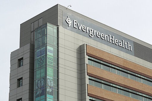 EvergreenHealth Medical Center is shown Tuesday, March 17, 2020, in Kirkland, Wash., near Seattle. In the area that has led the country in COVID-19 coronavirus cases and also across the country, hospitals are gearing up for an onslaught of coronavirus patients, but staff on the front lines are stretched thin and don't have the equipment they need to protect themselves from the highly contagious virus. (AP Photo/Ted S. Warren)