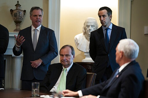 James Murren, President &amp; CEO of MGM, speaks during a meeting with President Donald Trump and tourism industry executives about the coronavirus, in the Cabinet Room of the White House, Tuesday, March 17, 2020, in Washington. From left, Murren, Richard Bates, EVP, Disney, Chip Rogers, President &amp; CEO, American Hotel &amp; Lodging Association, and Vice President Mike Pence. (AP Photo/Evan Vucci)