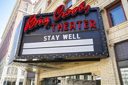 One side of the marquee of the Bing Crosby Theater reads &quot;stay well&quot; Monday, March 16, 2020, in downtown Spokane, Wash. On Sunday, Gov. Jay Inslee ordered gatherings of 50 people or more to stop; including entertainment venues. (Libby Kamrowski/The Spokesman-Review via AP)