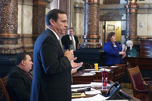 Kansas state Sen. Dennis Pyle, R-Hiawatha, debates a proposed budget of nearly $20 billion for state government, Tuesday, March 17, 2020, at the Statehouse in Topeka, Kan. Pyle questions whether the state should be committing the budget's proposed 6.7% spending increase when the coronavirus pandemic is creating economic uncertainty. (AP Photo/John Hanna)