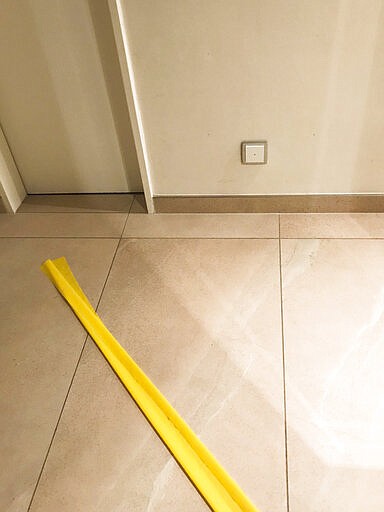 This photo taken on March 12, 2020 shows a yellow tape placed on the floor by the children of Karoline Preisler, to separate their home in Barth, Germany into areas for infected and non-infected persons of COVID-19 respiratory disease. Lonely, frightened and unwell, Preisler turned to the internet for information from other patients but didn&#146;t find many first-hand accounts of living with and fighting the virus. So she decided to share her experience on Twitter. (Karoline Preisler via AP)