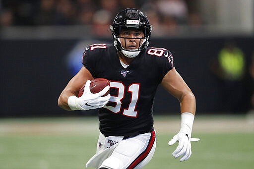 FILE - In this Sept. 29, 2019, file photo, Atlanta Falcons tight end Austin Hooper (81) runs against the Tennessee Titans during the first half of an NFL football game in Atlanta. The Browns are working toward a deal with two-time Pro Bowl free agent tight end Austin Hooper, a person familiar with the negotiations told The Associated Press. Hooper was one of the main free agency targets for Cleveland, said the person who spoke on condition of anonymity because teams can&#146;t officially announce deals until Wednesday, Marcg 18, 2020.(AP Photo/John Bazemore, File)