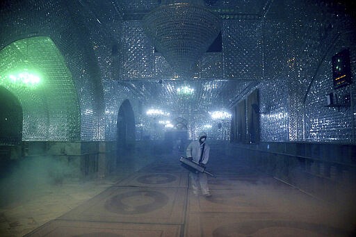 FILE &#151; In this Friday, March, 6, 2020 file photo, a firefighter disinfects the shrine of Saint Saleh to help prevent the spread of the new coronavirus in northern Tehran, Iran. Nine out of 10 cases of the virus in the Middle East come from the Islamic Republic. Days of denials gave the virus time to spread as the country marked the 41st anniversary of its 1979 Islamic Revolution. Iran also held a parliamentary election in which authorities desperately sought to boost turnout. For most people, the new coronavirus causes only mild or moderate symptoms. For some it can cause more severe illness. (AP Photo/Ebrahim Noroozi, File)