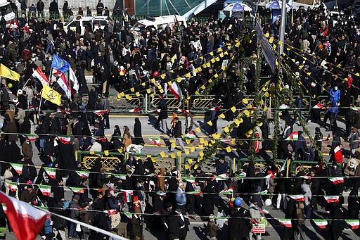 FILE &#151; In this Feb. 11, 2020 file photo, people celebrate the 41st anniversary of its 1979 Islamic Revolution, at Azadi (Freedom) Street, in Tehran, Iran, Tuesday. Nine out of 10 cases of the virus in the Middle East come from the Islamic Republic. Days of denials gave the virus time to spread as the country marked the  anniversary of the revolution. Iran also held a parliamentary election in which authorities desperately sought to boost turnout. For most people, the new coronavirus causes only mild or moderate symptoms. For some it can cause more severe illness. (AP Photo/Vahid Salemi, File)