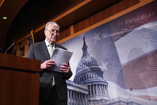 Senate Minority Leader Sen. Chuck Schumer of N.Y., walks off of the stage after speaking at a news conference on Capitol Hill in Washington, Tuesday, March 17, 2020. (AP Photo/Susan Walsh)