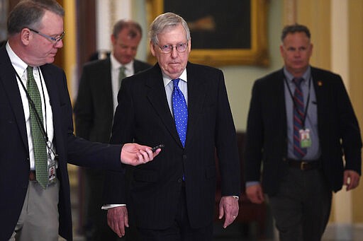 Senate Majority Leader Mitch McConnell of Ky., walks back to his office on Capitol Hill in Washington, Tuesday, March 17, 2020. (AP Photo/Susan Walsh)