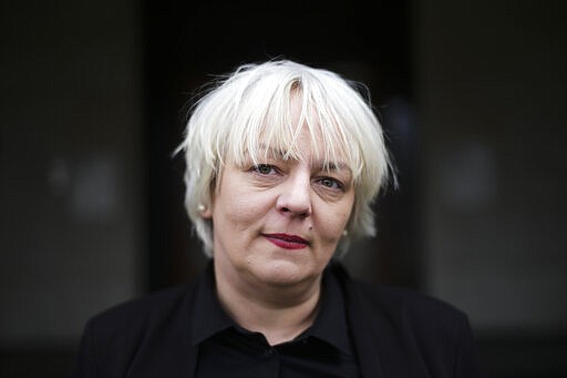 Susanne Bleier Wilp, a former sex worker and spokeswoman for the Association of Erotic and Sexual Services Proviers, or BESD, poses for a photograph after an interview with the Associated Press about the coronavirus outbreak for the business of sexworkers in Berlin, Germany, Wednesday, March 11, 2020. (AP Photo/Markus Schreiber)