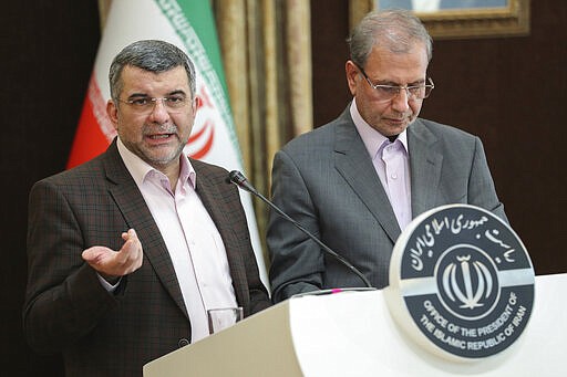 FILE &#151; In this Feb. 24, 2020 file photo, released by the official website of the office of the Iranian Presidency, the head of Iran's counter-coronavirus task force, Iraj Harirchi, left, speaks at a press briefing with government spokesman Ali Rabiei, in Tehran, Iran. Appearing before the cameras, sweating profusely and coughing, Harirchi, the man leading Iran's response to the new coronavirus promised it was of no danger to his country. A day later, he himself would be in quarantine from the virus. For most people, the new coronavirus causes only mild or moderate symptoms. For some it can cause more severe illness. (Iranian Presidency Office via AP, File)