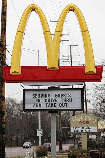 A sign informs customers of drive-thru or take out orders only at a McDonald's restaurant in Rolling Meadows, Ill., Wednesday, March 18, 2020. All bars and restaurants in the state to have closed their dining rooms through March 30. (AP Photo/Nam Y. Huh)