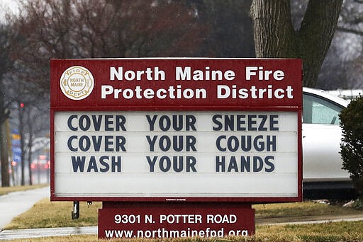 A sign for Des Plaines residents is displayed at North Maine Fire department in Des Plaines, Ill., Wednesday, March 18, 2020. (AP Photo/Nam Y. Huh)