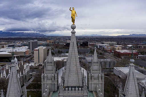 This Wednesday, March 18, 2020 photo shows the Angel Moroni statue atop the Salt Lake Temple of The Church of Jesus Christ of Latter-day Saints in Salt Lake City. An earthquake shook millions of people across metro Salt Lake City Wednesday, closing a major international airport hub, showering bricks onto sidewalks and damaging a spire and statue atop the Church of Jesus Christ of Latter-day Saints'  iconic Salt Lake Temple.  (Spenser Heaps/The Deseret News via AP)