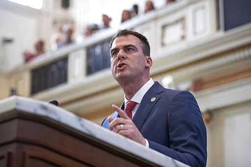 FILE - In this Feb. 3, 2020, file photo, Oklahoma Gov. Kevin Stitt delivers his State of the State address in Oklahoma City. An online state lottery game violates the gaming compacts between Oklahoma and the tribes and should bring an end to the exclusivity fees tribes pay the state each year, an Oklahoma-based tribe said in a court filing Tuesday, March 17, 2020. The compacts and the exclusivity fees tribes pay the state are at the center of a lawsuit the Cherokee, Chickasaw and Choctaw nations filed against Gov. Kevin Stitt.(AP Photo/Alonzo Adams, File)