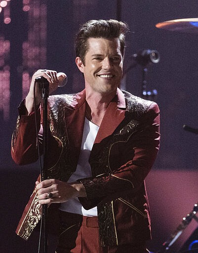 FILE - This April 14, 2018 file photo shows Brandon Flowers performing at the 2018 Rock and Roll Hall of Fame Induction Ceremony in Cleveland. The spreading coronavirus might have canceled several touring performances from A-list musical artists, but those acts have found creative ways to communicate with their fans. Flowers of The Killers tweeted a video of him washing his hands while singing the bands signature hit, Mr. Brightside." (Photo by Michael Zorn/Invision/AP, File)