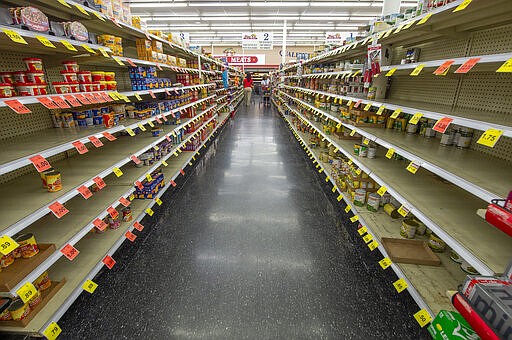 In light of the new coronavirus, Mac's Fresh Market in Ridgeland, Miss., limits quantities of certain items patrons can buy Tuesday, March 17, 2020. (Barbara Gauntt/The Clarion-Ledger via AP)