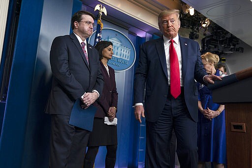 President Donald Trump departs after a press briefing with the coronavirus task force, at the White House, Wednesday, March 18, 2020, in Washington, with Veterans Affairs Secretary Robert Wilkie, Administrator of the Centers for Medicare and Medicaid Services Seema Verma and Dr. Deborah Birx, White House coronavirus response coordinator. (AP Photo/Evan Vucci)