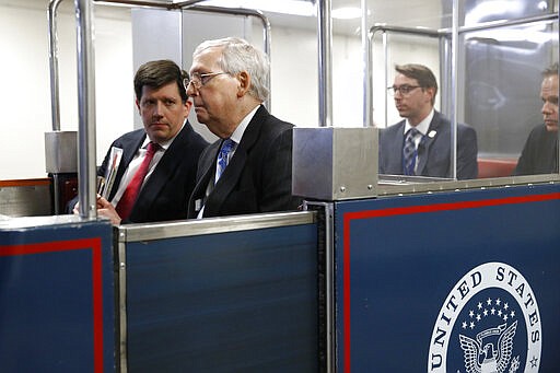 Senate Majority Leader Mitch McConnell of Ky., rides a subway car on Capitol Hill in Washington, Wednesday, March 18, 2020, before a vote on a coronavirus response bill. (AP Photo/Patrick Semansky)