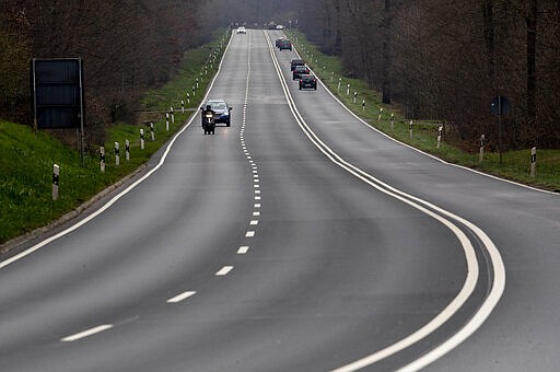 A usually highly frequented main connection between Frankfurt and the Taunus region is seen near Frankfurt, Germany, Wednesday, March 18, 2020. For most people, the new coronavirus causes only mild or moderate symptoms, such as fever and cough. For some, especially older adults and people with existing health problems, it can cause more severe illness, including pneumonia. (AP Photo/Michael Probst)