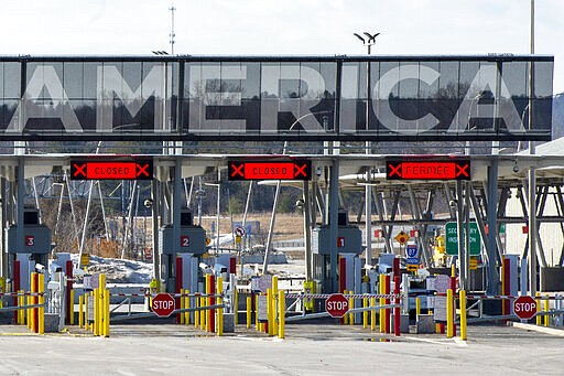 Several lanes at the United States border crossing in Lacolle, Quebec, is closed, Wednesday, March 18, 2020. The Canada-U.S. border will be closed to non-essential traffic in both directions &quot;by mutual consent,&quot; President Donald Trump confirmed Wednesday, as efforts across the continent to contain the widening COVID-19 pandemic continued to upend daily life in North America. (Ryan Remiorz/The Canadian Press via AP)