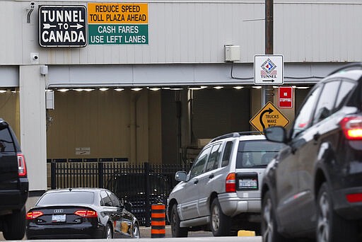 Vehicles enter the Detroit-Windsor Tunnel to travel to Canada in Detroit, Monday, March 16, 2020. Canadian Prime Minister Justin Trudeau says he is closing his country's borders to anyone not a citizen, an American or a permanent resident amid the coronavirus outbreak. (AP Photo/Paul Sancya)