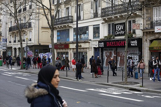 People line up at a supermarket, in Paris, March 17, 2020. (AP Photo/Thibault Camus)