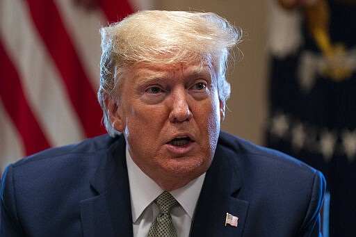 President Donald Trump speaks during a meeting with tourism industry executives about the coronavirus, in the Cabinet Room of the White House, Tuesday, March 17, 2020, in Washington. (AP Photo/Evan Vucci)