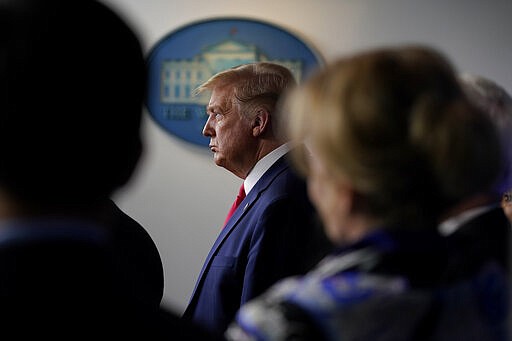 President Donald Trump listens during press briefing with the Coronavirus Task Force, at the White House, Wednesday, March 18, 2020, in Washington. (AP Photo/Evan Vucci)