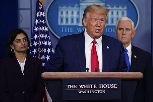 President Donald Trump speaks during press briefing with the Coronavirus Task Force, at the White House, Wednesday, March 18, 2020, in Washington. Administrator of the Centers for Medicare and Medicaid Services Seema Verma is at left, Vice President Mike Pence is at right. (AP Photo/Evan Vucci)