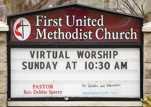 A sign outside the First United Methodist Church in Moscow, Idaho, notifies members on Wednesday, March 18, 2020, that church services will be held online. The temporary change was made to help slow the spread of the COVID-19 coronavirus. (Geoff Crimmins/Moscow-Pullman Daily News via AP)