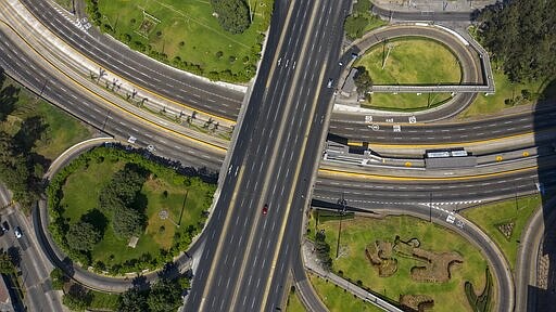 A highway exchange stands empty of traffic after the government implemented restrictions to prevent the spread of the new coronavirus in Lima, Peru, Wednesday, March 18, 2020. For most people COVID-19 causes mild or moderate symptoms. For others, especially the elderly and people with existing health problems, it can cause many other serious illnesses, including pneumonia. (AP Photo/Rodrigo Abd)