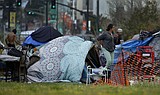 California rushes to try to contain virus among the homeless