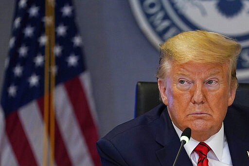 President Donald Trump attends a teleconference with governors at the Federal Emergency Management Agency headquarters, Thursday, March 19, 2020, in Washington. (AP Photo/Evan Vucci, Pool)