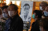 China exonerates doctor reprimanded for warning of virus