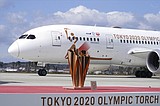 Olympic flame lands in Japan as doubts grow over Tokyo Games