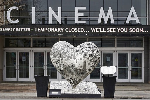 The Aksarben Village movie theater is closed in Omaha, Neb., Wednesday, March 18, 2020, due to the coronavirus outbreak. (AP Photo/Nati Harnik)