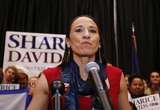 FILE - In this Nov. 6, 2018 file photo, Democrat House candidate&quot; Sharice Davids gives a victory speech to supporters at an election party in Olathe, Kan. Davids says she's self-quarantining after she had contact with another member of Congress who tested positive for coronavirus. Davids said in a Thursday, March 19, 2020, statement that she's following guidance from Congress' attending physician and working from home until March 26 &#147;out of an abundance of caution.&quot; She said she doesn't have symptoms.&#160;(AP Photo/Colin E. Braley, File)