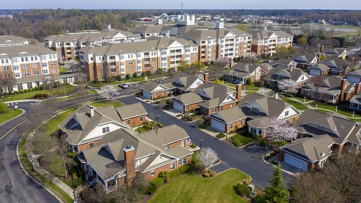 This Thursday March 19 , 2020 aerial photo, shows the grounds at Westminster Canterbury Richmond retirement home in Richmond, Va. The retirement home announced earlier this week that a patient was being treated at a hospital for coronavirus after returning from travel to Florida. Virginia health officials on Thursday confirmed at least the second case of a person infected with the new coronavirus in an assisted living facility, this one in the Washington suburbs of Falls Church, Va. (AP Photo/Steve Helber)